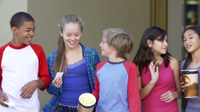 Slow Motion Sequence Of Teenagers Outside Cinema Together