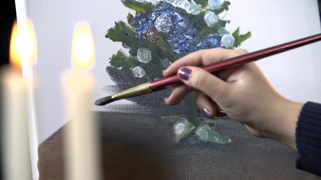 Hand painting a Christmas tree