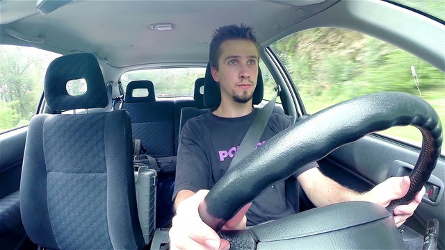 Fast driving car with vehicles passing by inside view