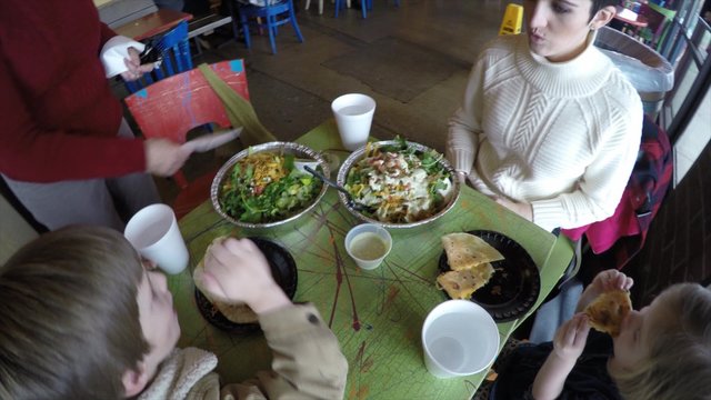 A Family Eating At A Mexican Restaurant