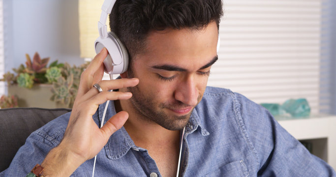 Handsome Mexican guy listening to music