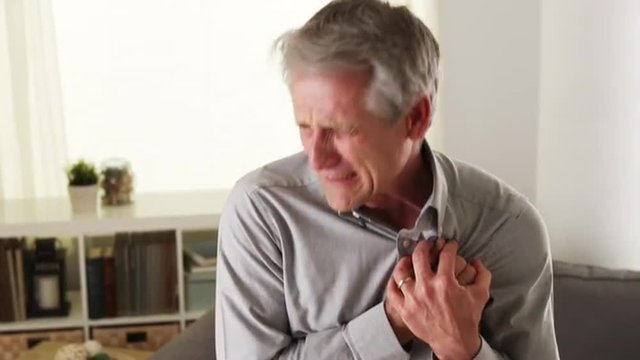 Mature man having heart attack