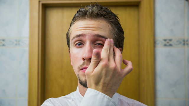 Fixing eyebrows with finger