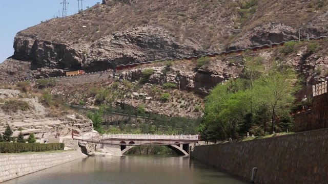 river by the hanging temple in datong china with tourists