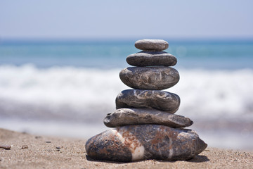 Fototapeta na wymiar Stack of pebbles on beach. Natural background