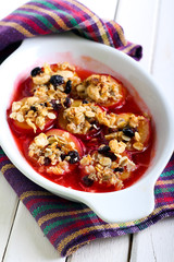 Baked plums with muesli crumble topping