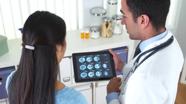 Chinese patient asking doctor questions about xray
