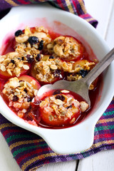 Baked plums with muesli crumble topping