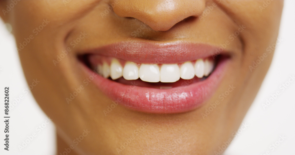 Wall mural close up of african woman with white teeth smiling