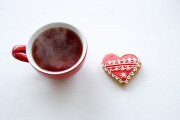 tea cup with sweet heart shaped cookie