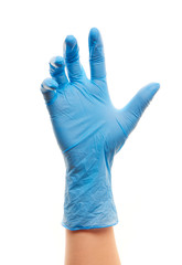 Female doctor's hand in blue sterilized surgical glove