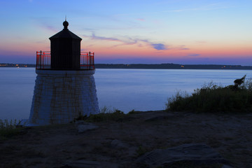 Lighthouse on a rocky shore.