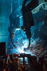 robots welding in a car factory