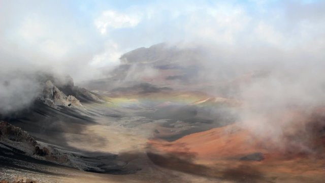 Rainbow over volcano crater