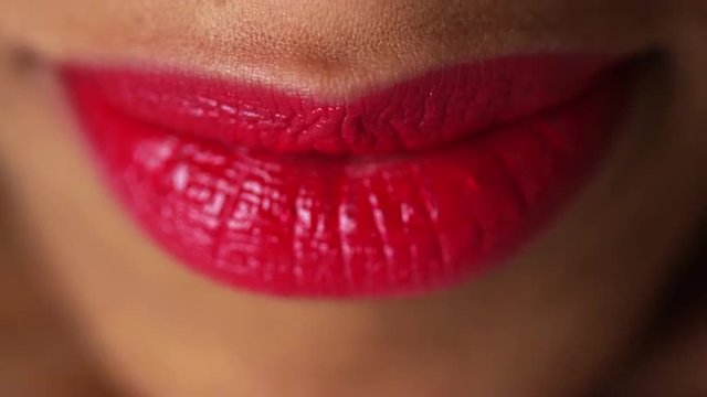 Closeup of woman pressing lips together