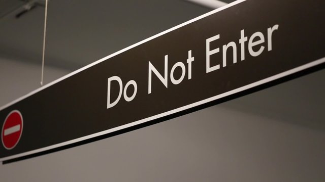 a do not enter sign in a parking garage