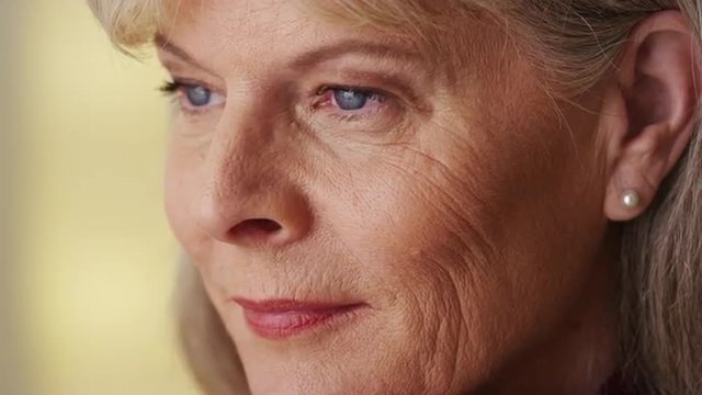 Gorgeous mature woman looking away closeup