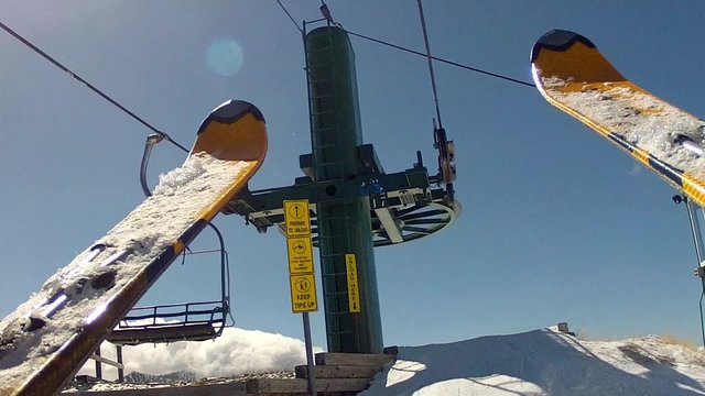 skier gets off chair lift