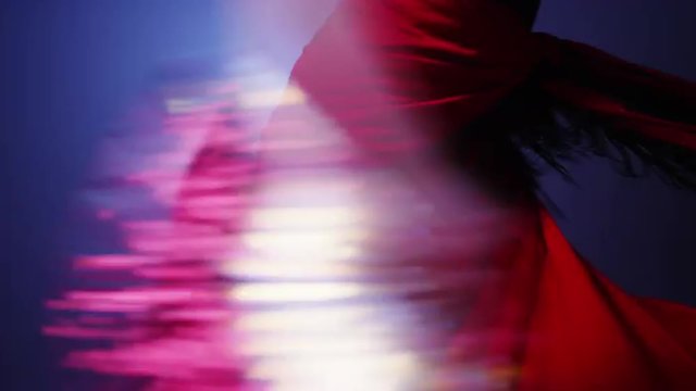 Mixed race flamenco dancer twirling in costume