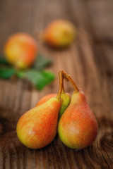 Ripe pear on a wooden background