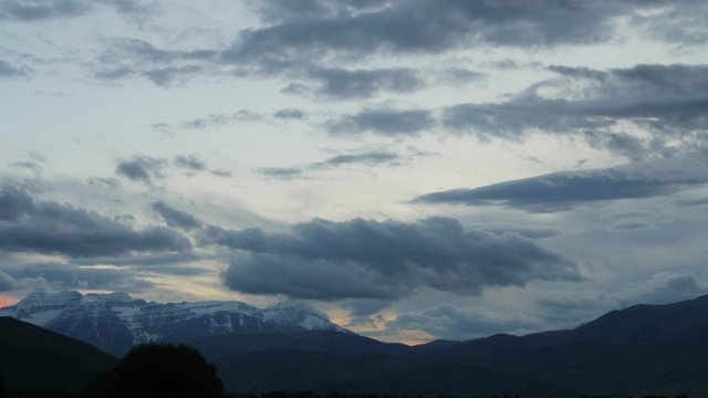 Timelapse storm clouds above a mountain range