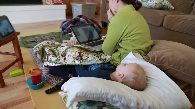 a mom with her sick toddler at home