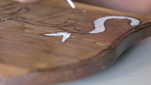 White word letters on wooden plank