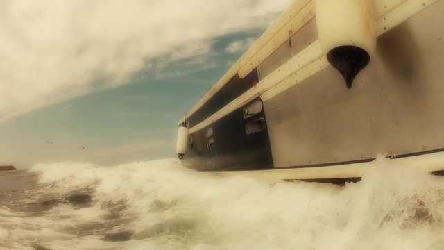 low shot of a large fishing boat on traveling across the ocean
