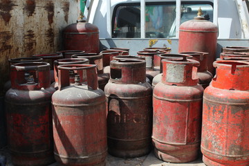Old red gas cylinders.
High pressure propane or LPG gas cylinders.
