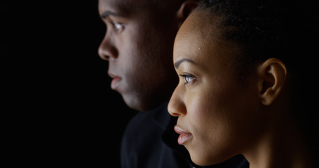 Dramatic profile rack focus of two young black people