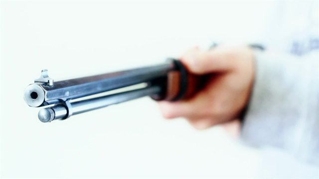 gunman holding a rifle