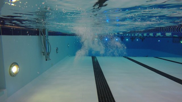 Underwater pool shot of a man swimming