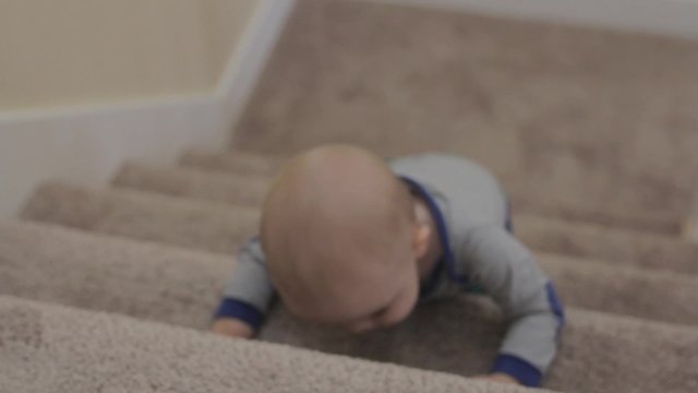 a little boy playing on the stairs