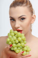 Cheerful young girl with fresh green fruit