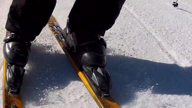 man skiing across the snow