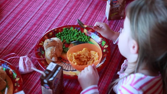 Little Girl Eating Macaroni