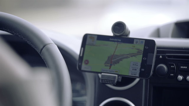 GPS navigation in car with woman driving