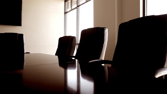 chairs in conference room dolly shot