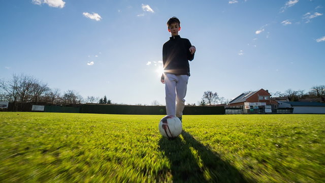 Boy dribble soccer ball