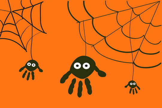 Spiders with hand prints halloween background