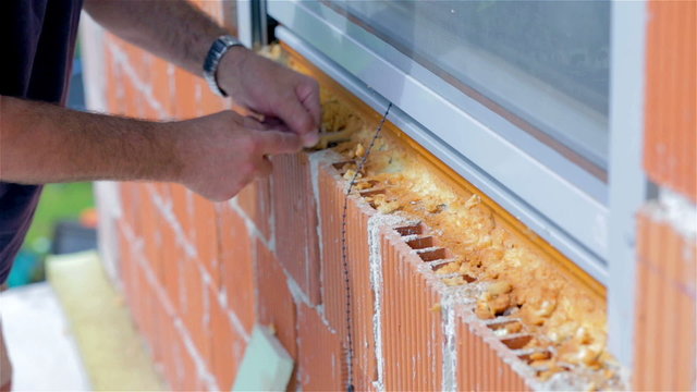 Removing excess propen around window close up