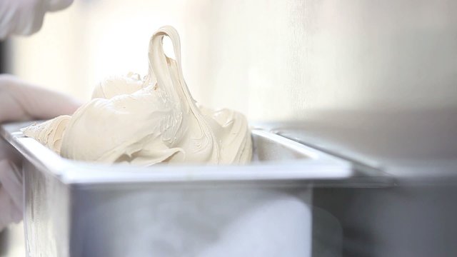 prepare ice cream with professional machine, hazelnut flavor