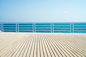 wooden floor, sea ,blue sky