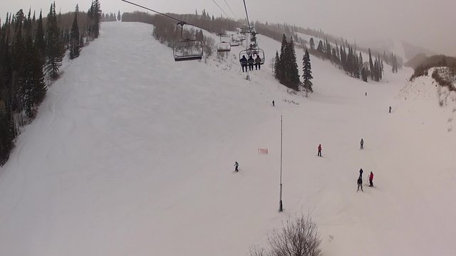 high up on a ski lift in storm