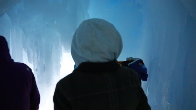 family walking in an ice cave