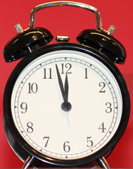 Retro Black Alarm Clock with Red Background