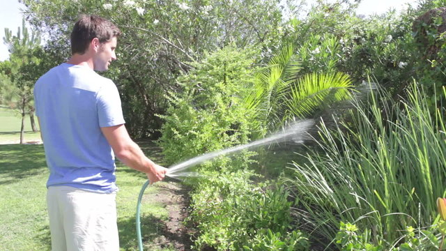 Man Watering Garden