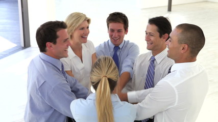 Businessmen And Businesswomen Joining Hands To Celebrate 