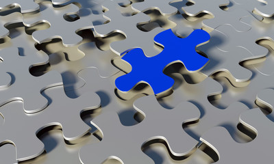 Blue piece on top of layered puzzle pieces