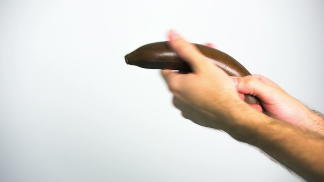 Playing with black banana